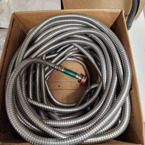 lot 297 image: Stainless steel garden hose approx 75 ft.