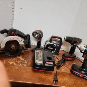 lot 306 image: Craftsman 19.2 volt trim saw, work light, AMFMLux weather, Impact drill, drill, 2 batteries with charger (all work good)