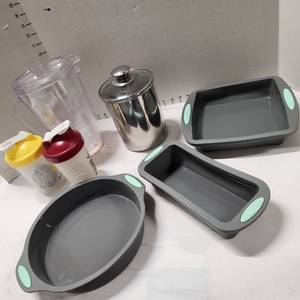 lot 518 image: Plastic pitcher, 2 shaker cups, stainless steel container and 3 silicone baking dishes set of 3 appears new