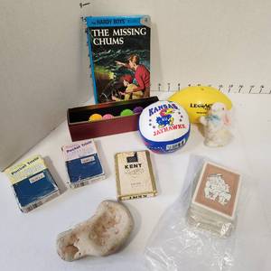 lot 636 image: Hardy Boys hardback book, KU Jayhawks ball, pocket trivia cards, playing cards and more