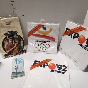lot 681 image: Barcelona Olympic 1992 tshirts size large (unopened), 1972 Olympic Holiday travel guide, Special Olympic Games tshirt size large (unopened)