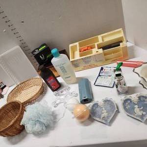 lot 691 image: First aid supplies organizer, bath bombs, Avon Skin So Soft, peroxide, baskets soap dish holders and more