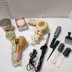 lot 693 image: Candles, hairdryer, massager, curling iron, brushes and combs