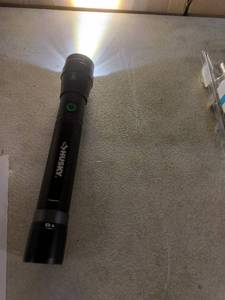 lot 6388 image: Husky. 5000 Lumens Flash Light Charger Not Included