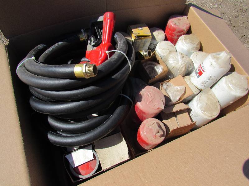 lot 7520 image: Box of Oil  Filters  Gas Pump & Hose