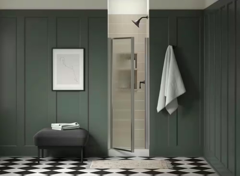 lot 18 image: New Sterling Standard Rain Glass Silver Finish 25 in. W x 65 in. H Pivot Framed Shower Door