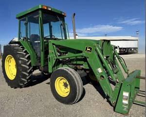 lot 100 image: Very Nice John Deere 5410 Diesel Tractor w Cab and John Deere 520 Loader w Bale Spear and Joystick Control - 81HP 3445 Hours - Lift Capacity 4030lbs