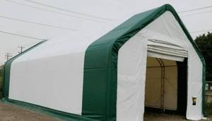 lot 275 image: Unused in Container 2024 Double Truss Peak Storage Shelter 20x32x16 w Mechanical Door - Double Trussed Hot Dip Galvanized Steel Frame 2.44m Arch Interval Storage Building - Durable Waterproof UV Resistant  Model 203216DP Retail $7,600