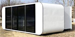 lot 280 image: Unused 2024 Apple Cabin w Slide Out to Almost Double Its Size - USA Standard Wiring & Plumbing - Washroom w ShowerWindowLightBasinKitchen Cabinets - Kitchen with Cabinets Upgraded to Stone Top w White Cabinets - Retail $52,000