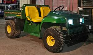 lot 105 image: John Deere Gator 4x2 Gas Engine w Dumping Bed & Tailgate - All New Seats, Battery, Wiring Harness & Auxiliary Wiring, Ignition System, Fuel Pump, Carburetor, Gas Lines, Plug, Filters, Fluids, New LED Bulbs, 3 New Tires, 1 New Tube. THIS IS A NICE ONE