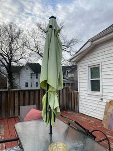 lot 254 image: Rectangular Patio Umbrella (Green) with a cast iron base