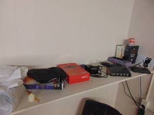 lot 1157 image: Contents of shelf - WIFI router and more