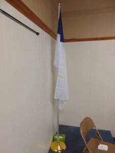 lot 1160 image: Christian flag with heavy base and pole