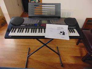 lot 1232 image: Casio keyboard with stand
