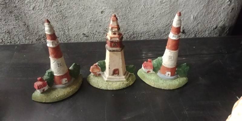 lot 6195 image: Cast Iron Lighthouse Door Stops