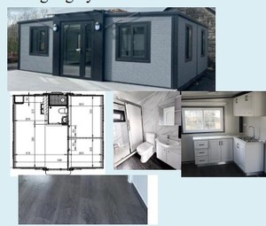 lot 100 image: Unused Fold Out Home  2 Bedrooms, with Kitchen cabinet, with electrics with grey cladding.