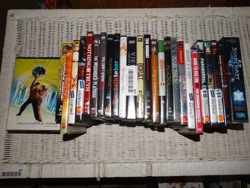 lot 407 image: Large Lot of DVDVHS Movies & Dance Instruction Videos.