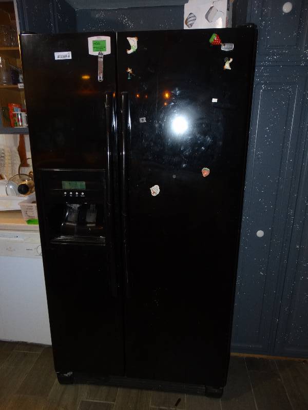 lot 495 image: Maytag Black Side by Side RefrigeratorFreezer wWater & Ice in the Door.