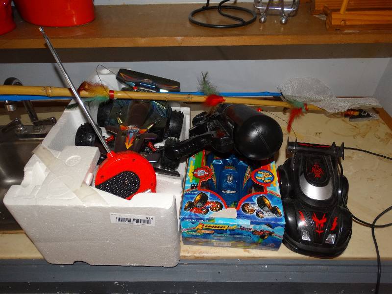 lot 914 image: Lot of Toys Remote Control Cars, Water Gun, Spear, Butterfly Net.