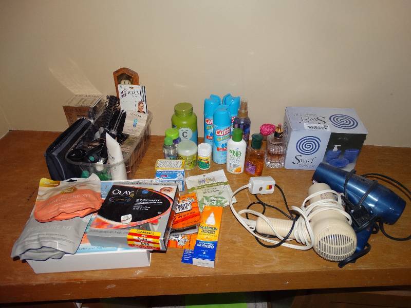 lot 931 image: Blow Dryers, Bath Set, Bug Repellent, Perfume, Vitamins, ManiPedi Kits, Brushes, & Bathroom Items.