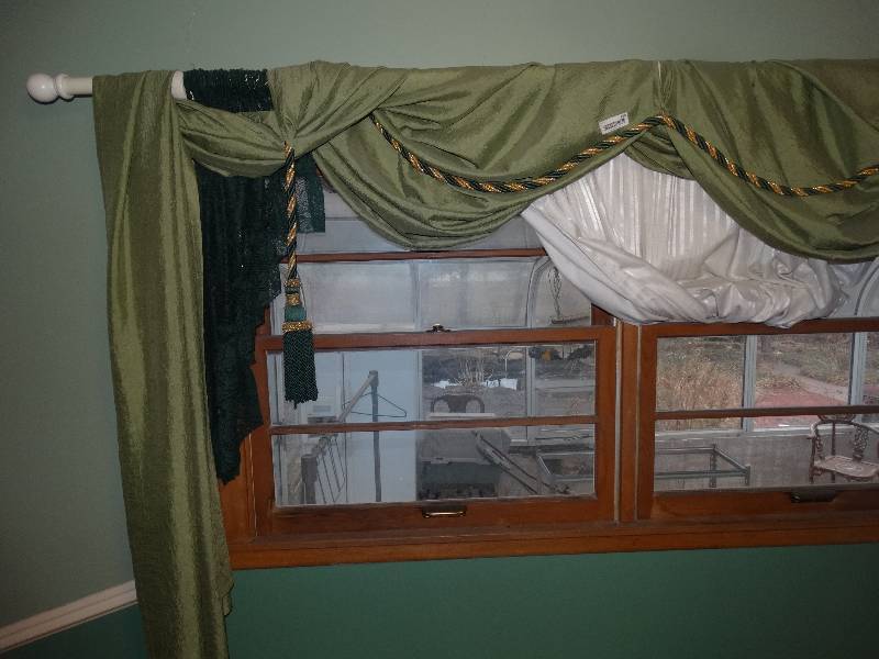 lot 950 image: Curtains, Rods, & Holders over Windows in Green Bedroom.