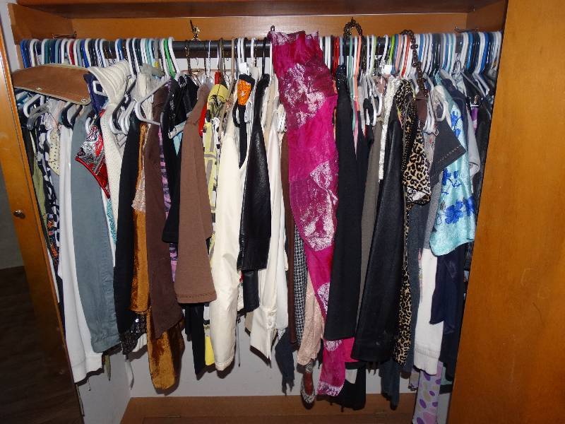 lot 962 image: Clothes & Boots in Left Closet - in Large Bedroom.