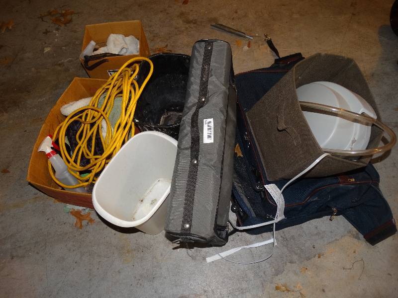 lot 975 image: Lot of LuggageHanging Bags, Trash Cans, Select Comfort Pump, Cleaning Supplies, Heavey Extension Cord.