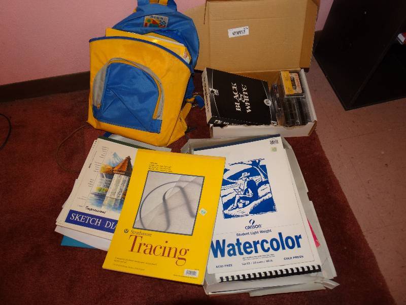 lot 1096 image: Backpack & Box of Sketch Pads, Tracing Paper, Watercolor Pad, Cassette Tapes, VHS Movies.