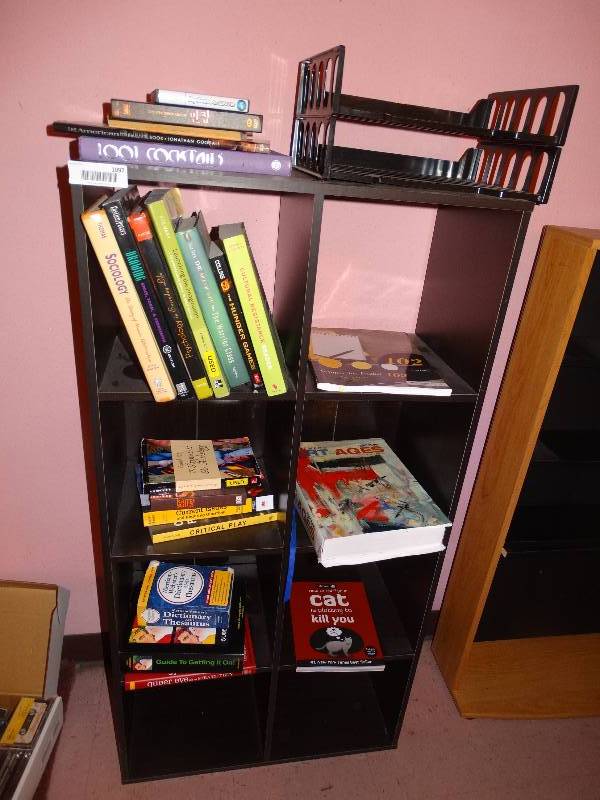 lot 1097 image: Black BookcaseCubby Stand wAll ContentsBooks.