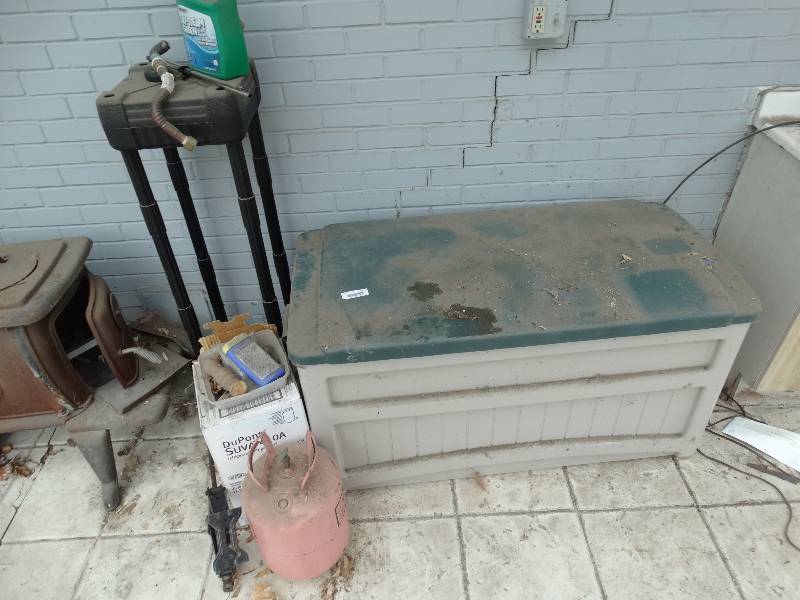 lot 1120 image: Plastic Planter Stand, Suncast Outdoor Storage Chest wContents, Metal Refrigerant Bottles, Jack, Misc.