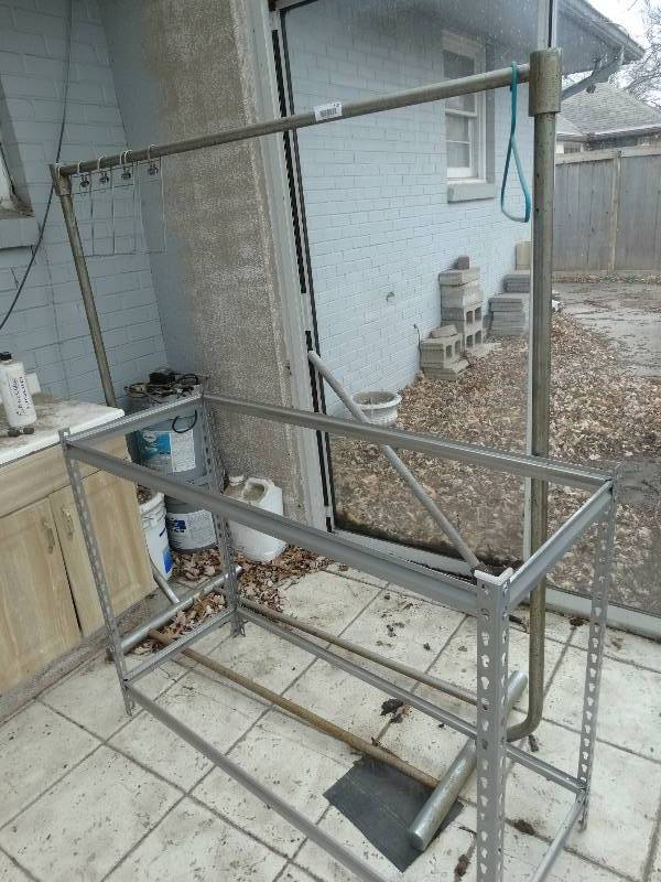 lot 1121 image: Dry Cleaners Rack, Metal Shelf Frame, Partial 5 Gal. Buckets of Paint, Cleaner, etc.
