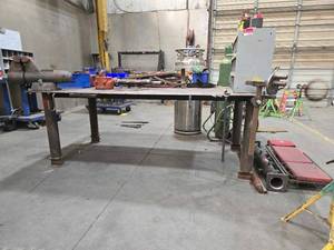 lot 48699 image: Industrial Heavy-Duty Workbench with Vises CONTENTS OF TABLE NOT INCLUDED