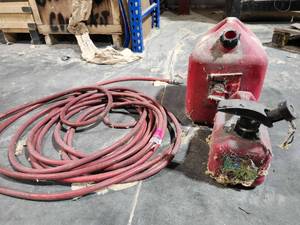 lot 50304 image: Industrial Gas Hose with Fuel Cans