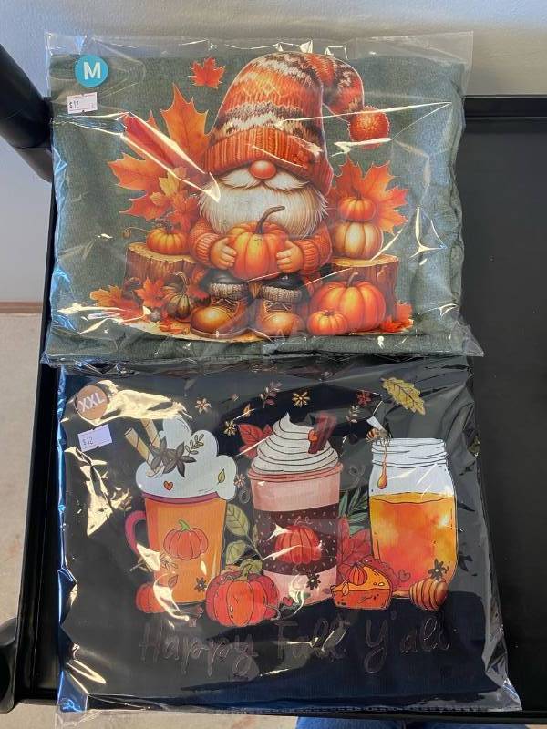 lot 2563 image: (2) Fall T-shirts Size 1- Medium and 1- XXL