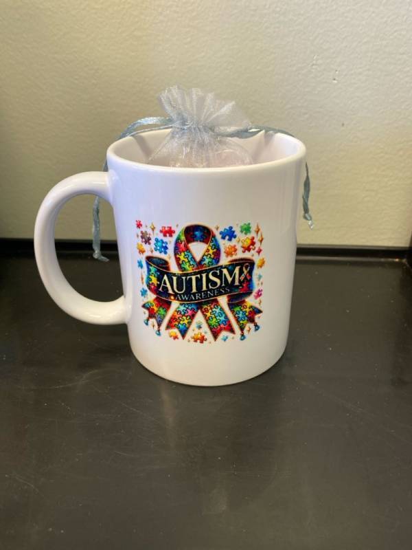 lot 2465 image: Autism Awareness coffee cup complete with a bag of hard mints- Perfect for gifting