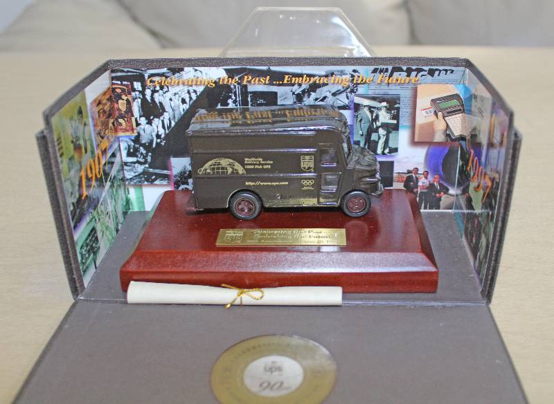 lot 8099 image: UPS 90 Year Celebration Plaque- Wow