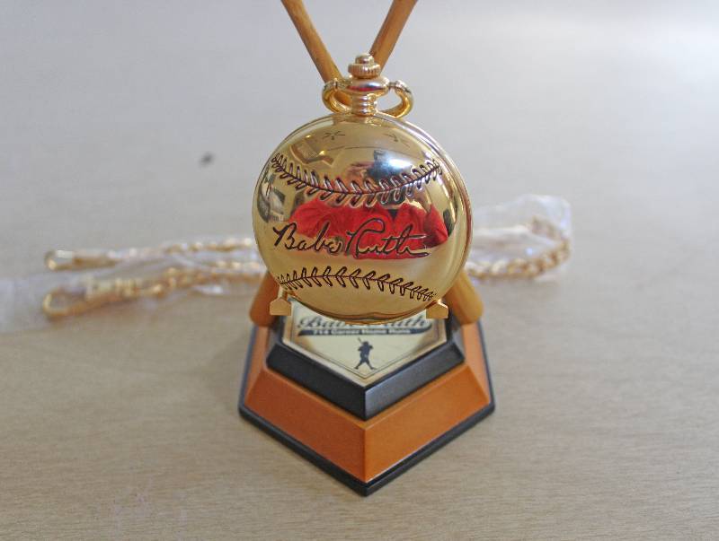 lot 8101 image: Babe Ruth Pocket Watch w Home Plate and Bat Stand- Check it Out