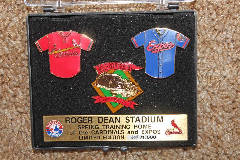 lot 7777 image: Roger Dean Stadium Collectors Set Lapel Pins- Check it Out