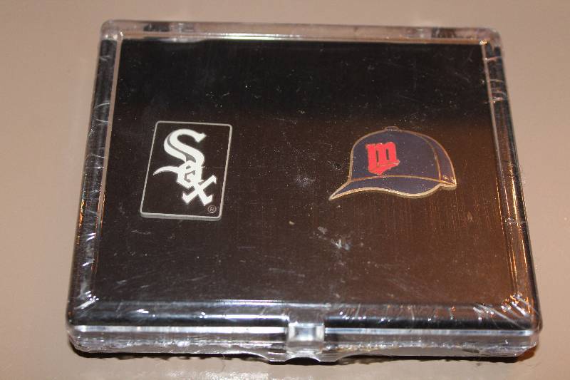 lot 8831 image: Pin Set - SOX pin and the ball cap has an M on it