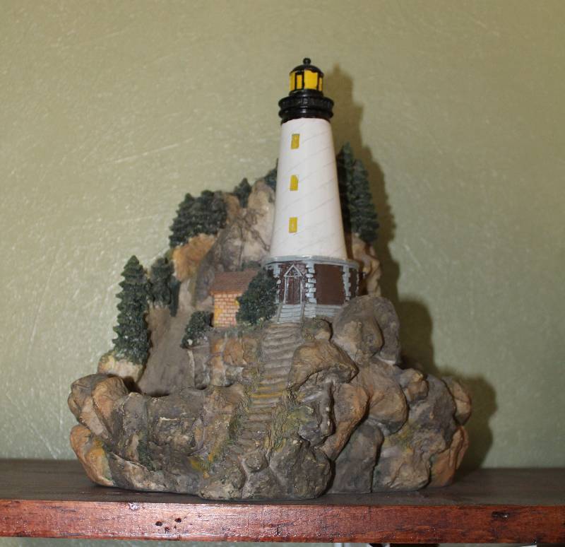lot 5003 image: Lighthouse Figurine on a coastline - 10 tall