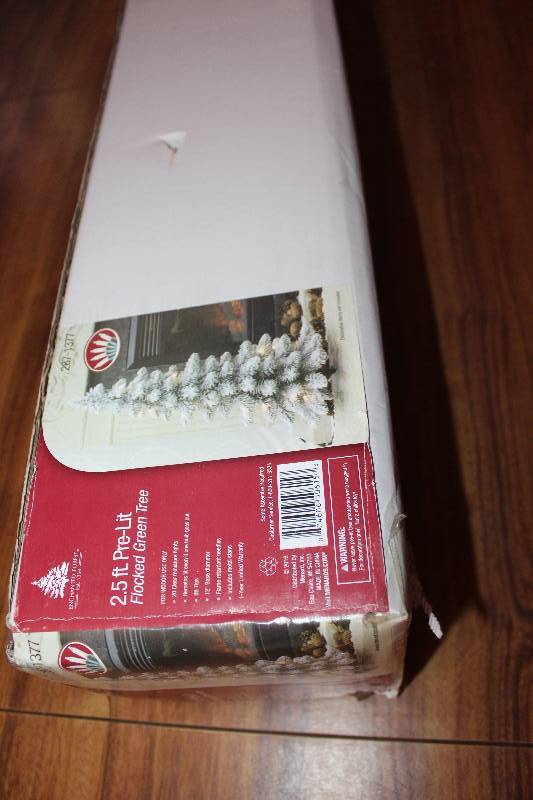 lot 8193 image: 2.5 Foot Prelit Christmas Tree- Flocked Green Tree- Wow