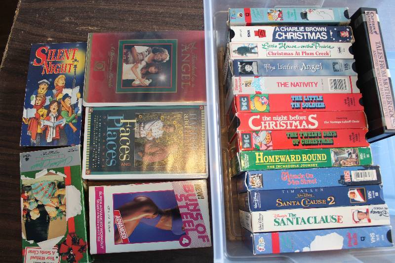 lot 8369 image: Assorted VHS Tapes w Plastic Box