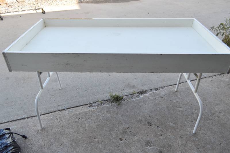 lot 3137 image: Merchandisedump table - good for keeping small parts on table with folding legs 60 x 30 x 33 tall