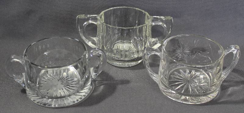 lot 9753 image: Set of Three Vintage Clear Glass Sugar Bowls with Handles.