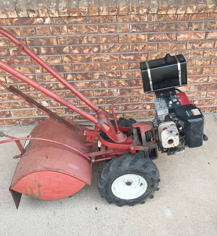 lot 9997 image: Troy Bilt Garden Tiller with Planting Plow - 8 HP Rototiller - Bid Now  WATCH VIDEO 
