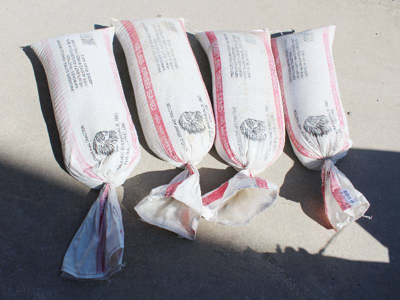 lot 3031 image: 4 bags of sand- 60 pounds each