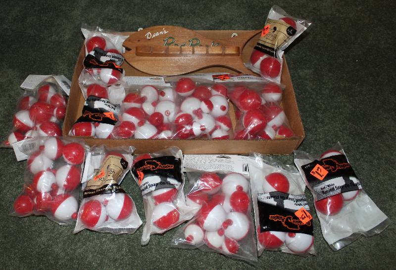 lot 8570 image: Lot of 13 Packages of Fishing Bobbers and a Cute Wooden Pole Holder