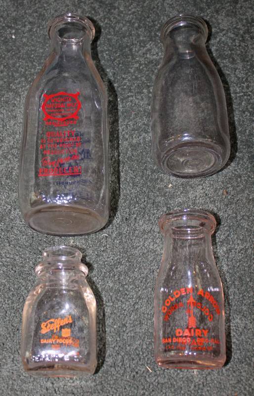 lot 8609 image: Lot of 4 Milk Bottles - see pics