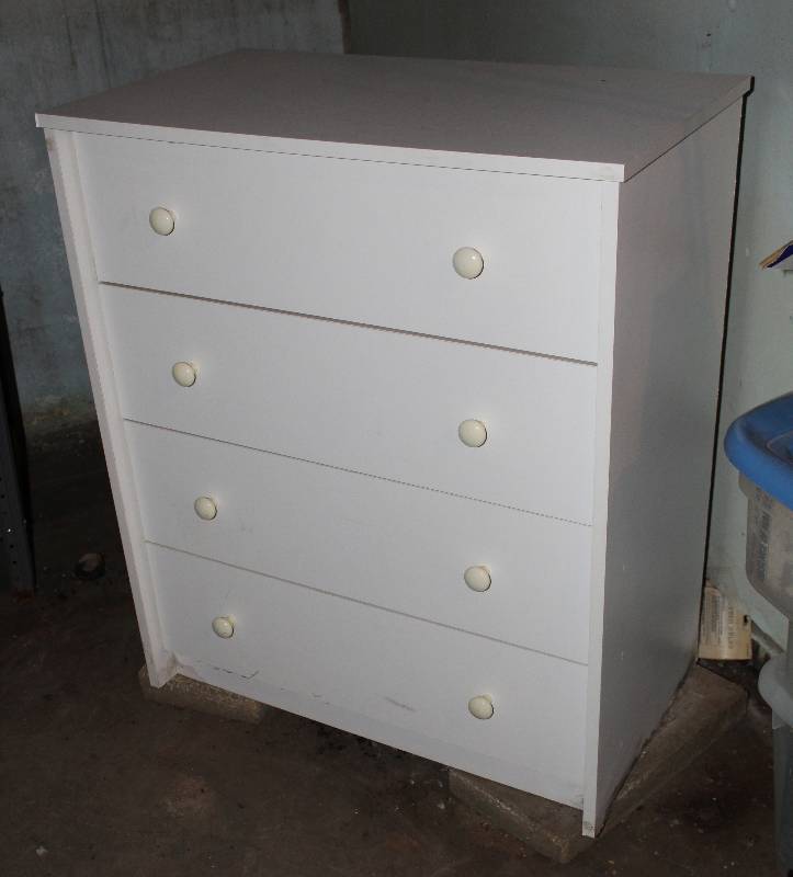 lot 8705 image: Four-Drawer Chest of Drawers