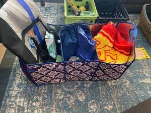 lot 132 image: Tailgating supplies- KC Chiefs blanket, battery pack, radio, Atlas, coldhot bag and 3 compartment tailgate tote